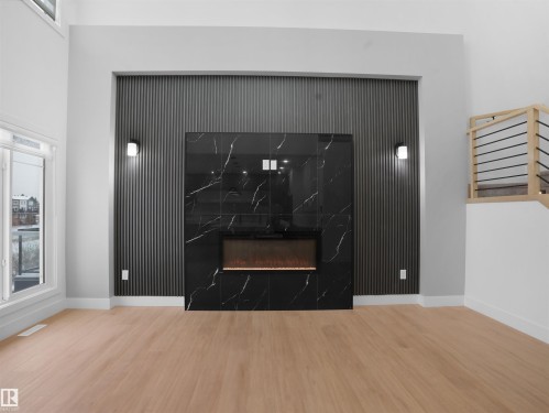 6009 Naden Landing Landing, Edmonton, AB - Indoor Photo Showing Living Room With Fireplace