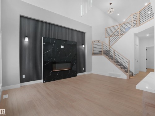 6009 Naden Landing Landing, Edmonton, AB - Indoor Photo Showing Other Room With Fireplace