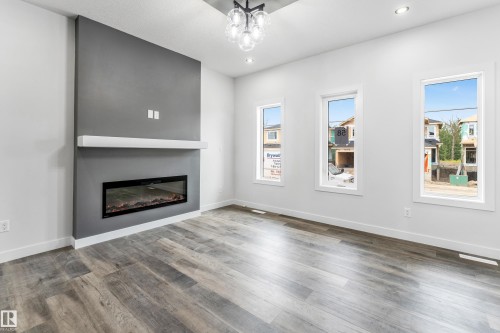 58 Patriot Way, Spruce Grove, AB - Indoor Photo Showing Living Room With Fireplace