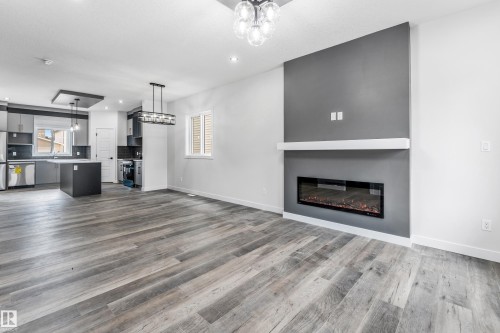 58 Patriot Way, Spruce Grove, AB - Indoor Photo Showing Living Room With Fireplace