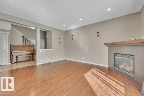 3054 Spence Wynd, Edmonton, AB - Indoor Photo Showing Other Room With Fireplace