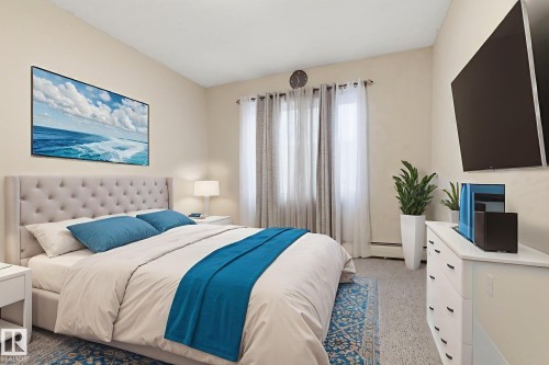 Bedroom with a baseboard radiator - 205 11440 40 Ave, Edmonton, AB - Indoor Photo Showing Bedroom