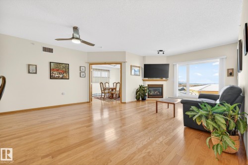 418 200 Bethel Drive, Sherwood Park, AB - Indoor Photo Showing Living Room With Fireplace