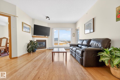 418 200 Bethel Drive, Sherwood Park, AB - Indoor Photo Showing Living Room With Fireplace