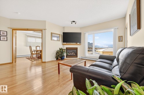 418 200 Bethel Drive, Sherwood Park, AB - Indoor Photo Showing Living Room With Fireplace