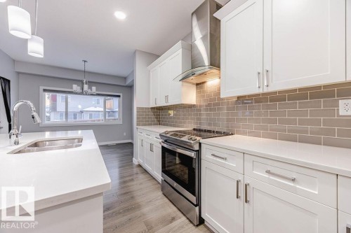 704 Conroy Crest, Edmonton, AB - Indoor Photo Showing Kitchen With Double Sink With Upgraded Kitchen