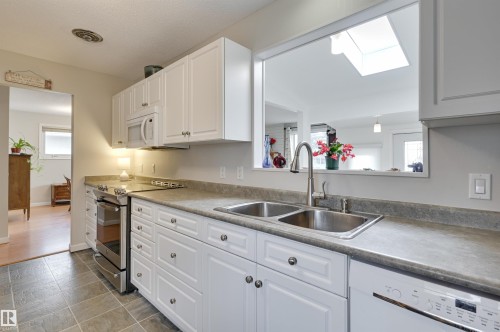 6704 94 Avenue, Edmonton, AB - Indoor Photo Showing Kitchen With Double Sink