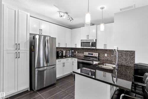 212 5151 Windermere Boulevard, Edmonton, AB - Indoor Photo Showing Kitchen With Double Sink With Upgraded Kitchen