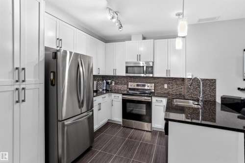 212 5151 Windermere Boulevard, Edmonton, AB - Indoor Photo Showing Kitchen With Double Sink