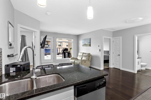 212 5151 Windermere Boulevard, Edmonton, AB - Indoor Photo Showing Kitchen With Double Sink