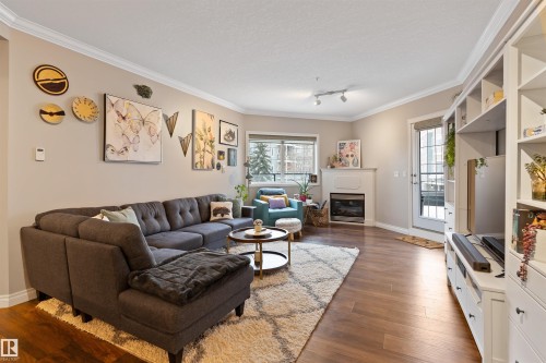 202 10116 80 Avenue, Edmonton, AB - Indoor Photo Showing Living Room With Fireplace