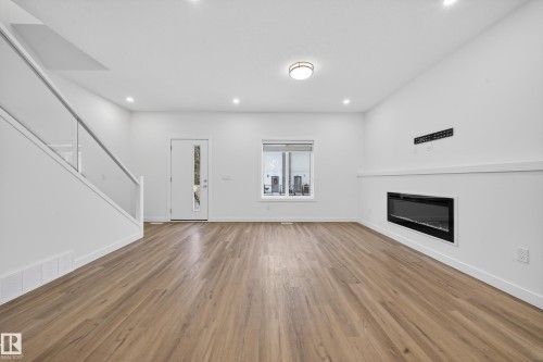 1 10 Salisbury Way, Sherwood Park, AB - Indoor Photo Showing Living Room With Fireplace