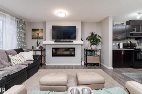 8533 Ellis Link, Edmonton, AB - Indoor Photo Showing Living Room With Fireplace