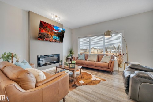 944 Berg Place, Leduc, AB - Indoor Photo Showing Living Room With Fireplace