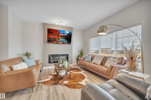 944 Berg Place, Leduc, AB - Indoor Photo Showing Living Room With Fireplace