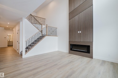 286 Munn Way, Leduc, AB - Indoor Photo Showing Other Room With Fireplace