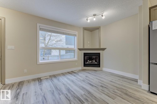 1820 34 Avenue, Edmonton, AB - Indoor Photo Showing Living Room With Fireplace