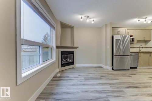 1820 34 Avenue, Edmonton, AB - Indoor Photo Showing Kitchen With Fireplace