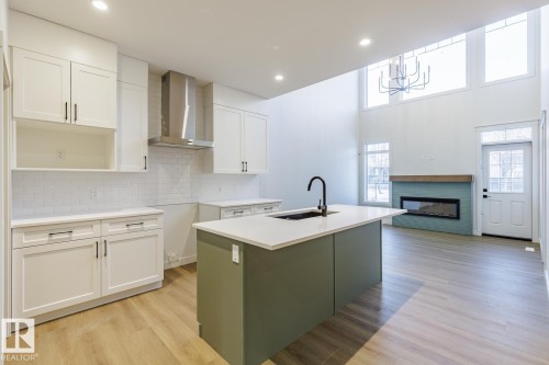 17537 62A Street, Edmonton, AB - Indoor Photo Showing Kitchen With Fireplace