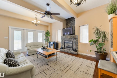 55 24524 Twp Road 544, Rural Sturgeon County, AB - Indoor Photo Showing Living Room With Fireplace
