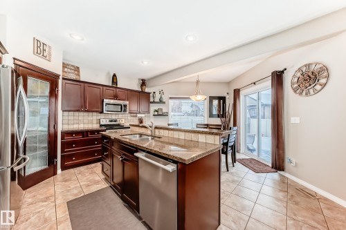 25 Woodbridge Link, Fort Saskatchewan, AB - Indoor Photo Showing Kitchen With Double Sink