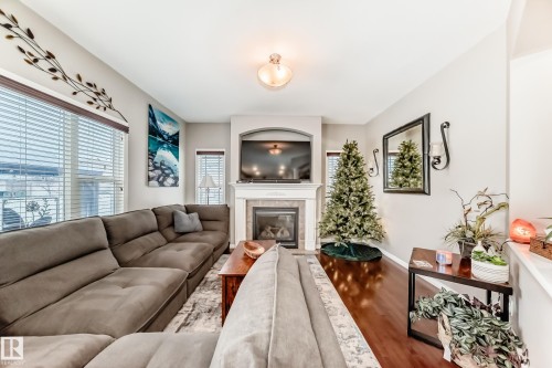 25 Woodbridge Link, Fort Saskatchewan, AB - Indoor Photo Showing Living Room With Fireplace