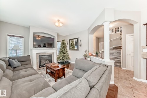 25 Woodbridge Link, Fort Saskatchewan, AB - Indoor Photo Showing Living Room With Fireplace