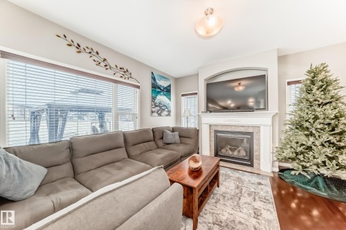25 Woodbridge Link, Fort Saskatchewan, AB - Indoor Photo Showing Living Room With Fireplace