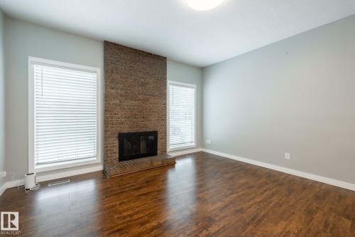 15003 58 Street, Edmonton, AB - Indoor Photo Showing Living Room With Fireplace