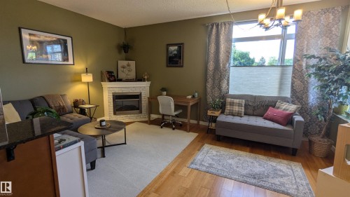 203 11140 68 Avenue, Edmonton, AB - Indoor Photo Showing Living Room With Fireplace