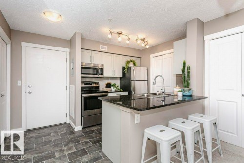 106 5816 Mullen Place, Edmonton, AB - Indoor Photo Showing Kitchen With Double Sink