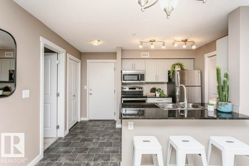 106 5816 Mullen Place, Edmonton, AB - Indoor Photo Showing Kitchen With Double Sink