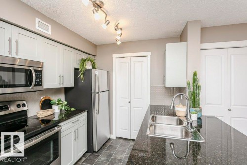106 5816 Mullen Place, Edmonton, AB - Indoor Photo Showing Kitchen With Double Sink With Upgraded Kitchen