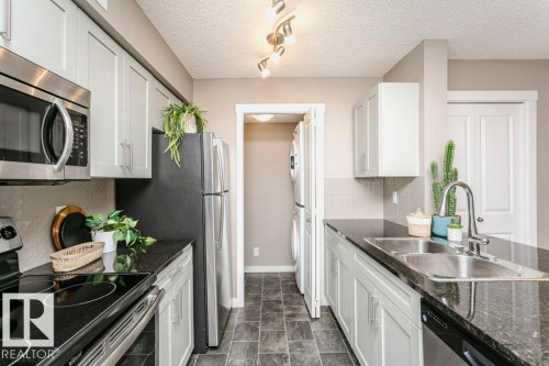 106 5816 Mullen Place, Edmonton, AB - Indoor Photo Showing Kitchen With Double Sink With Upgraded Kitchen