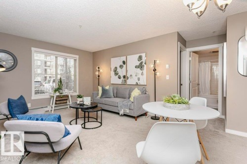 106 5816 Mullen Place, Edmonton, AB - Indoor Photo Showing Living Room
