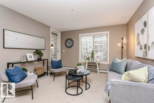 106 5816 Mullen Place, Edmonton, AB - Indoor Photo Showing Living Room