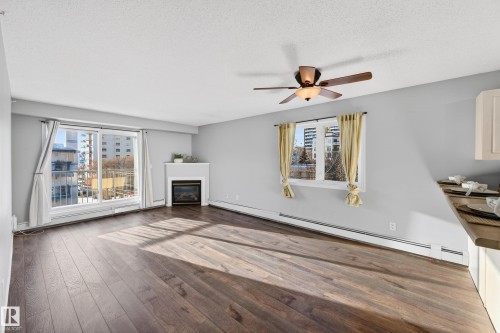 418 10403 98 Avenue, Edmonton, AB - Indoor Photo Showing Living Room With Fireplace