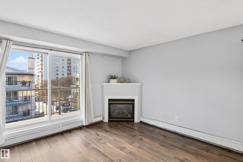 418 10403 98 Avenue, Edmonton, AB - Indoor Photo Showing Living Room With Fireplace