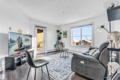 308 1080 Mcconachie Boulevard Nw, Edmonton, AB - Indoor Photo Showing Living Room