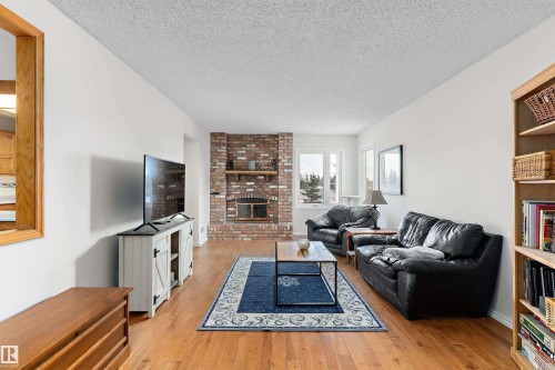 5020 147 Street, Edmonton, AB - Indoor Photo Showing Living Room With Fireplace