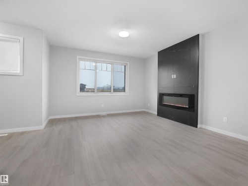 3331 Roy Brown Way, Edmonton, AB - Indoor Photo Showing Living Room With Fireplace