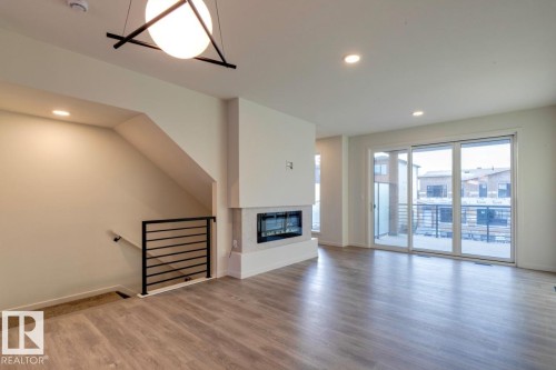 7513 Klapstein Link Link, Edmonton, AB - Indoor With Fireplace