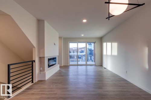 7513 Klapstein Link Link, Edmonton, AB - Indoor With Fireplace
