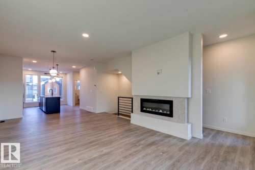 7513 Klapstein Link Link, Edmonton, AB - Indoor Photo Showing Living Room With Fireplace