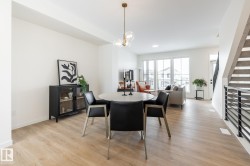 Dining room featuring light wood-style flooring and baseboards - 