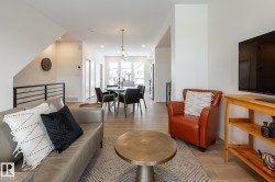 Living room featuring light wood finished floors and recessed lighting - 