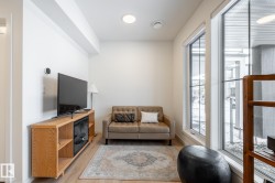 Living area featuring light wood finished floors and baseboards - 