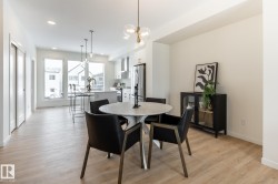 Dining area with light wood-style floors and recessed lighting - 