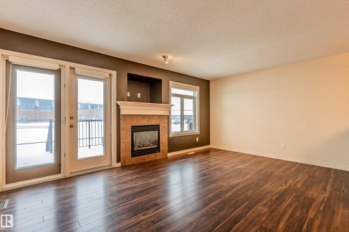 28 9511 102 Ave, Morinville, AB - Indoor Photo Showing Living Room With Fireplace