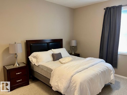 400 9940 Sherridon Drive, Fort Saskatchewan, AB - Indoor Photo Showing Bedroom
